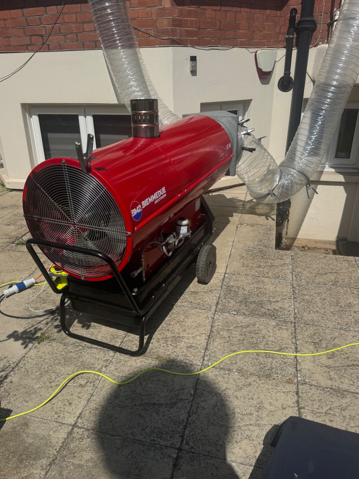 Close-up of the BM2 Biemmedue industrial heater fan and ducting during a bed bug heat treatment